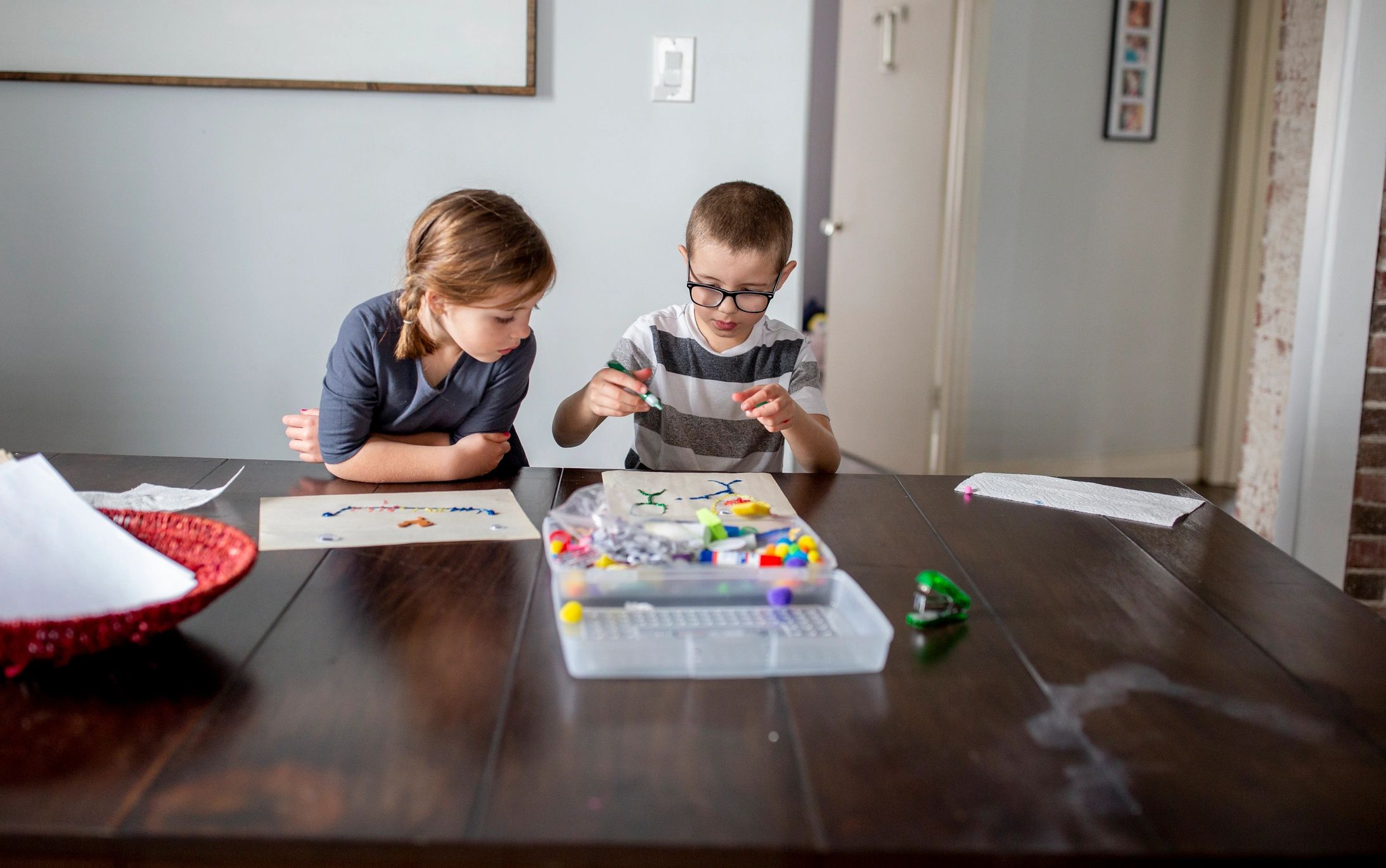 Family role-playing together at a table, learning and bonding