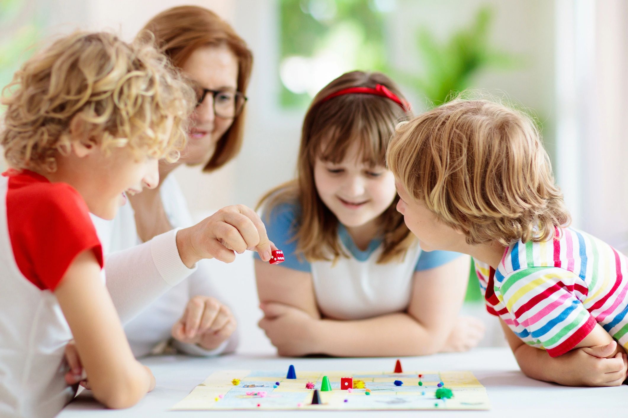 homeschool family playing board game