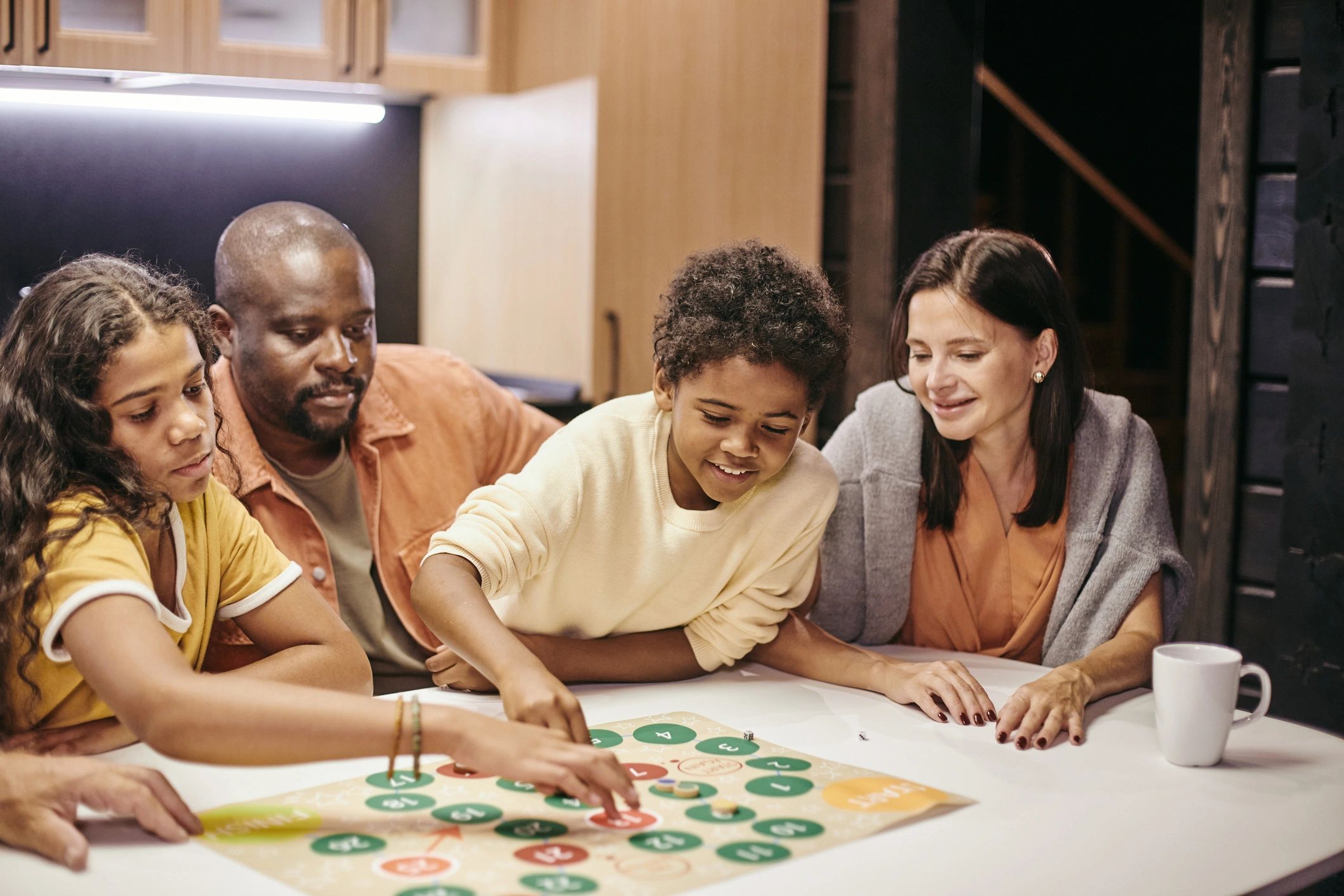 homeschool family playing board game