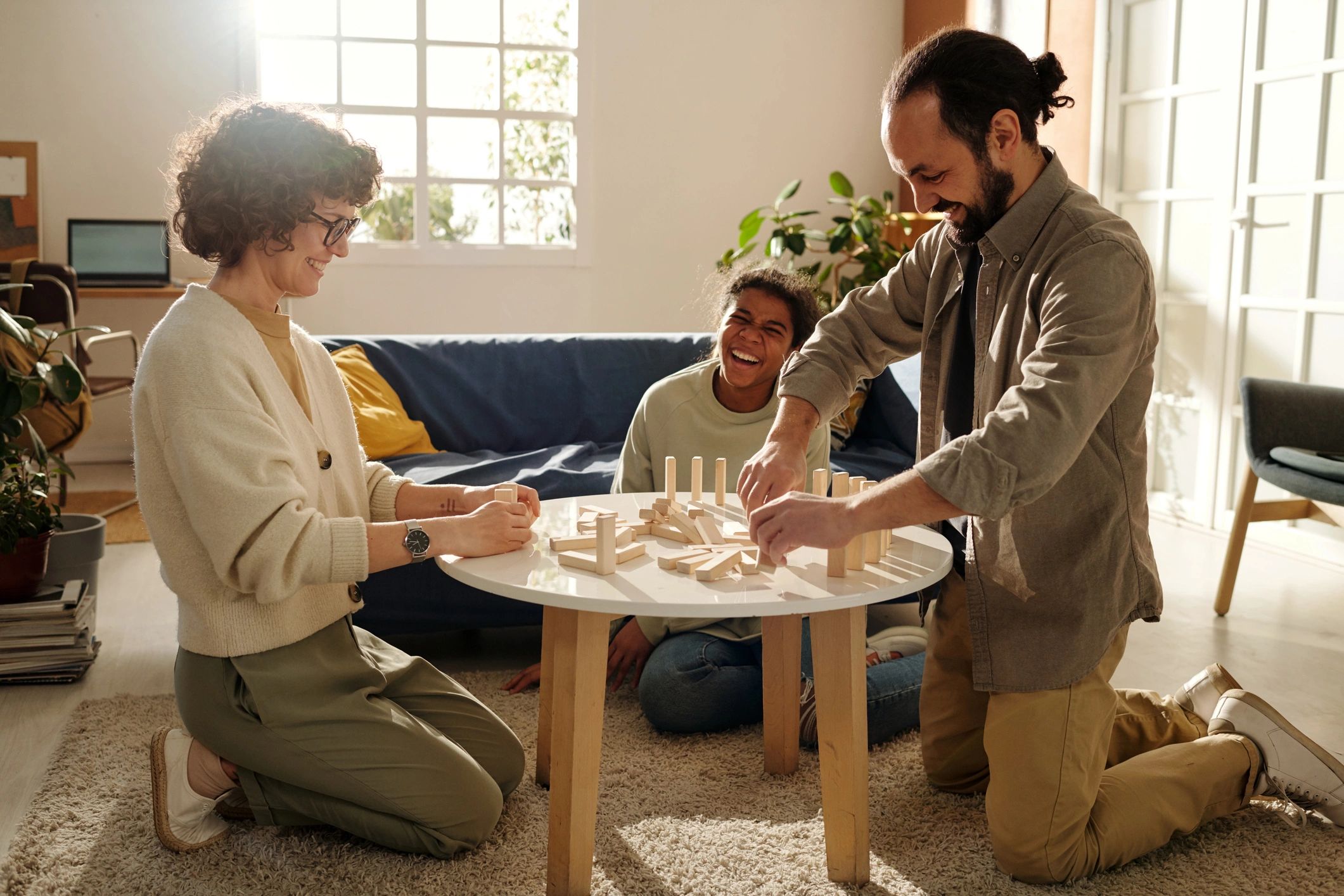 family playing tabletop games cozy home