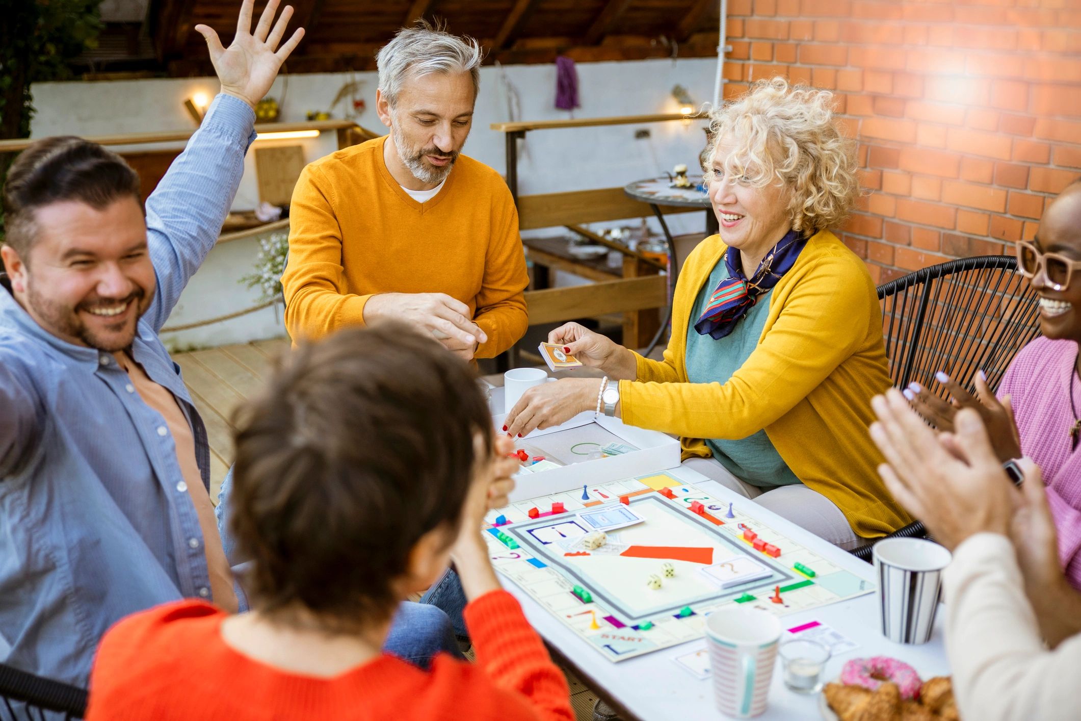 Children and parents enjoying a tabletop game