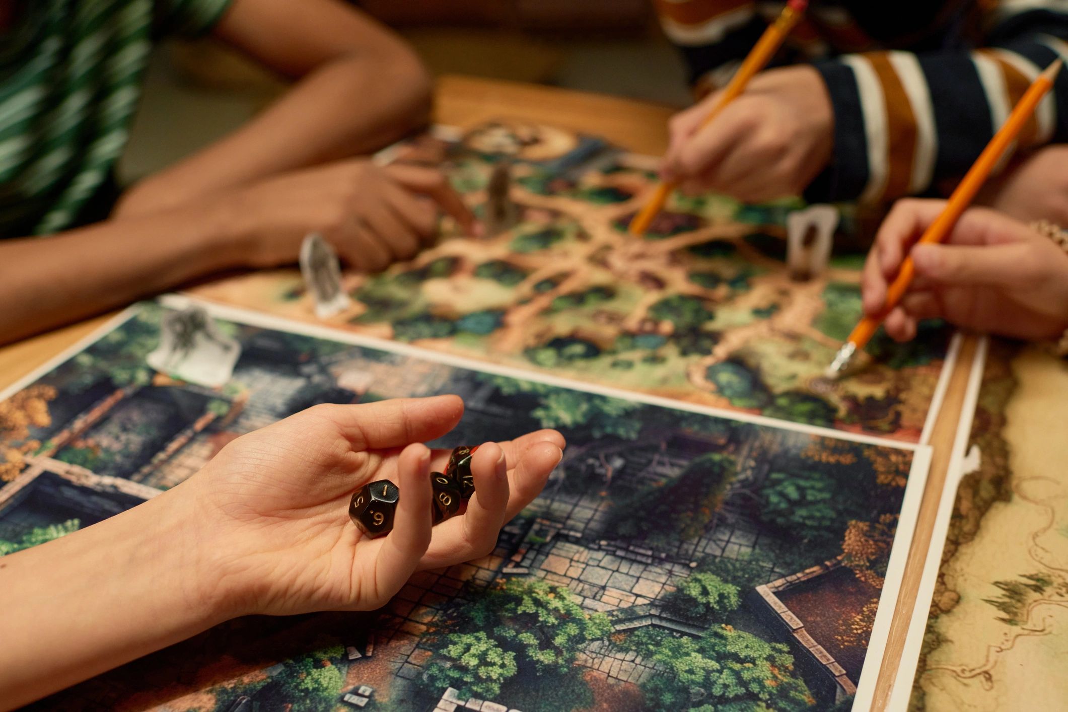 tabletop dice books hands in action