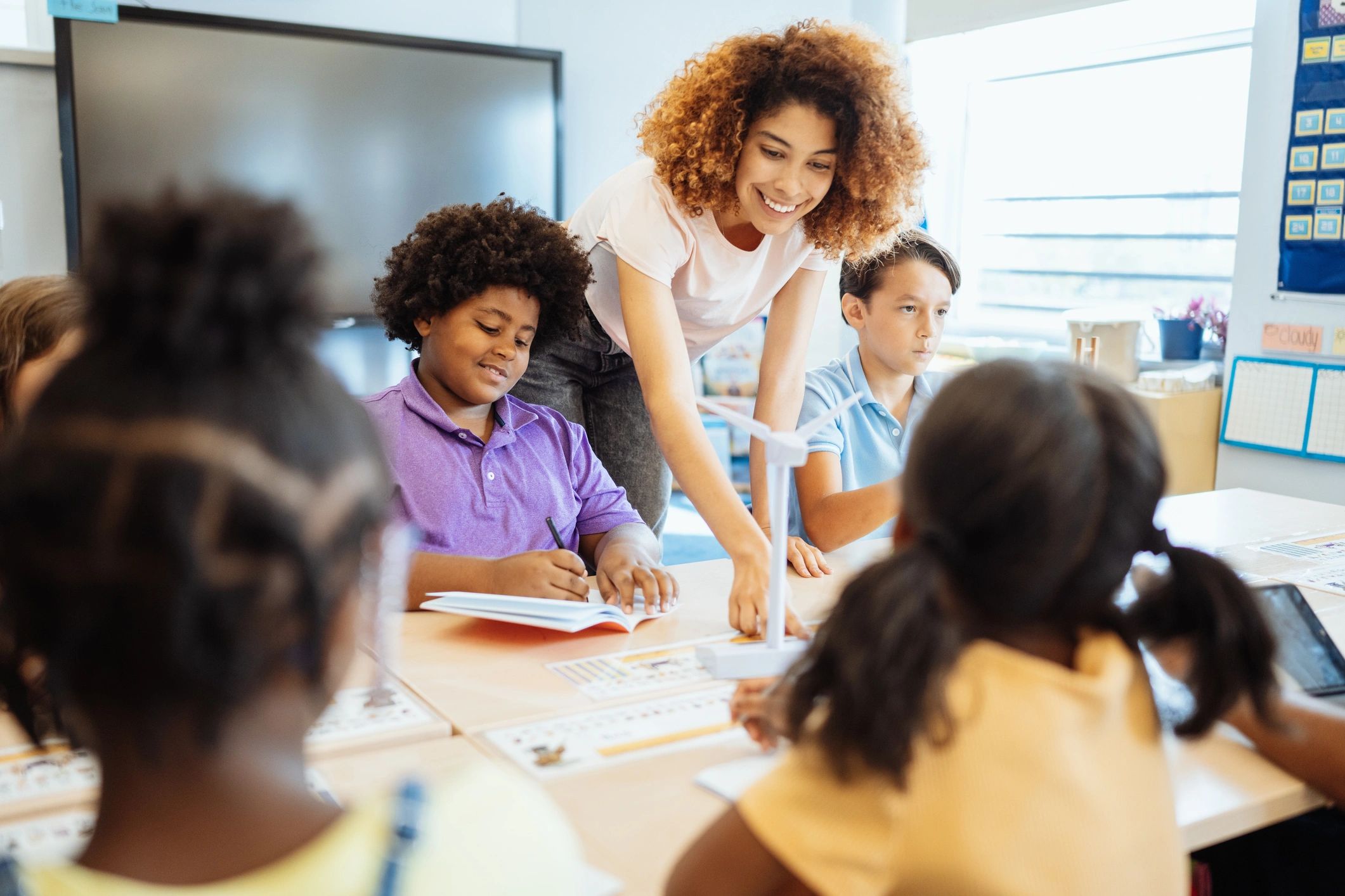 educator facilitating tabletop activity