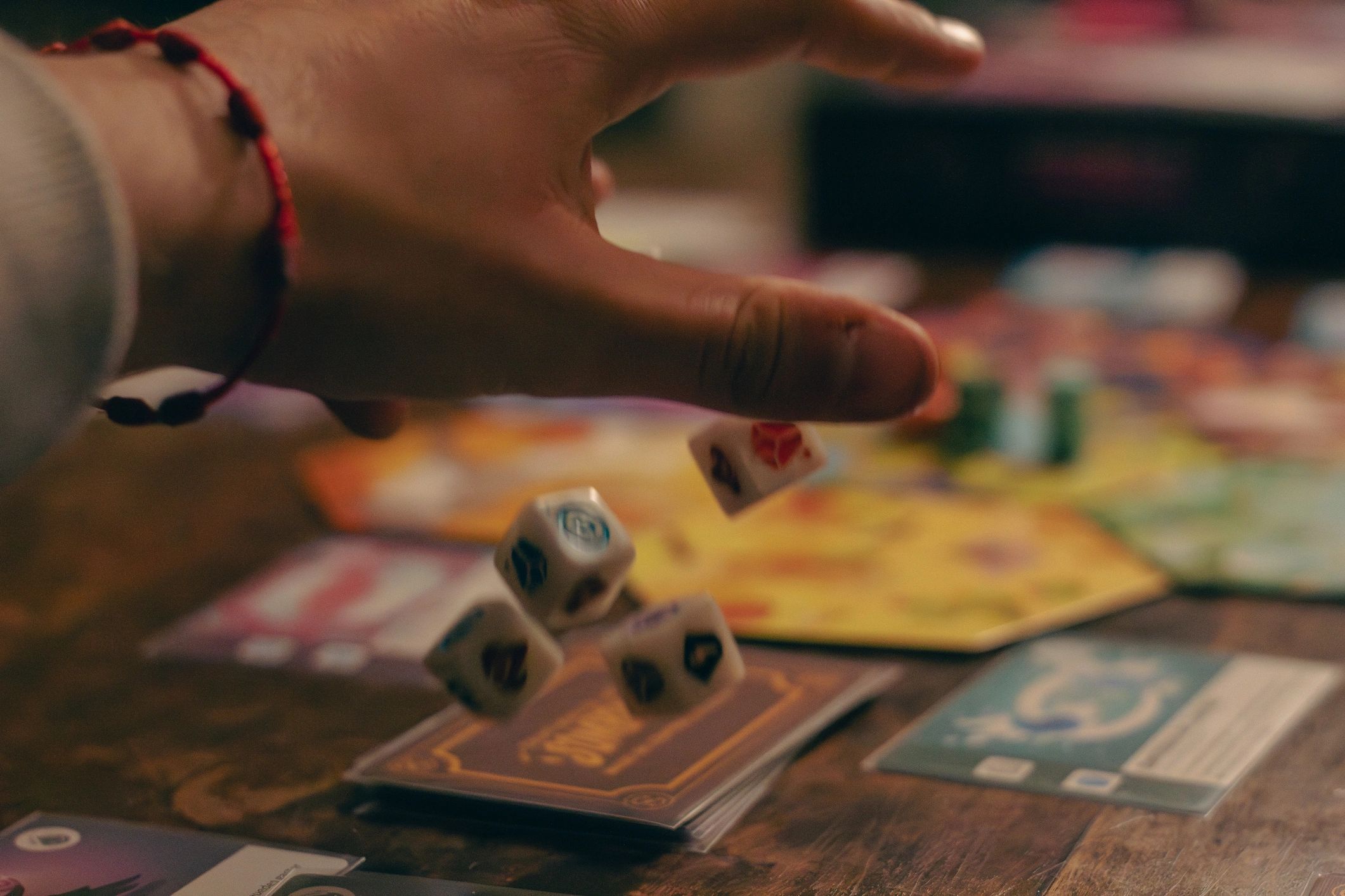 tabletop dice books hands in action